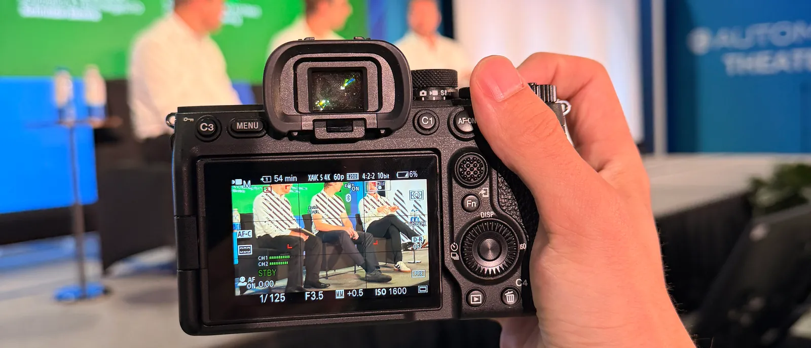 Corporate video production crew covering a panel discussion event in Chicago