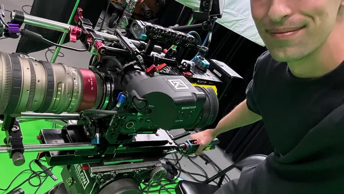 Camera operator capturing footage that becomes multiple video assets