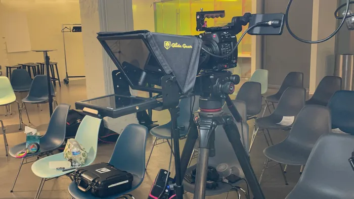 Teleprompter-guided on-camera introduction filmed from a production brief