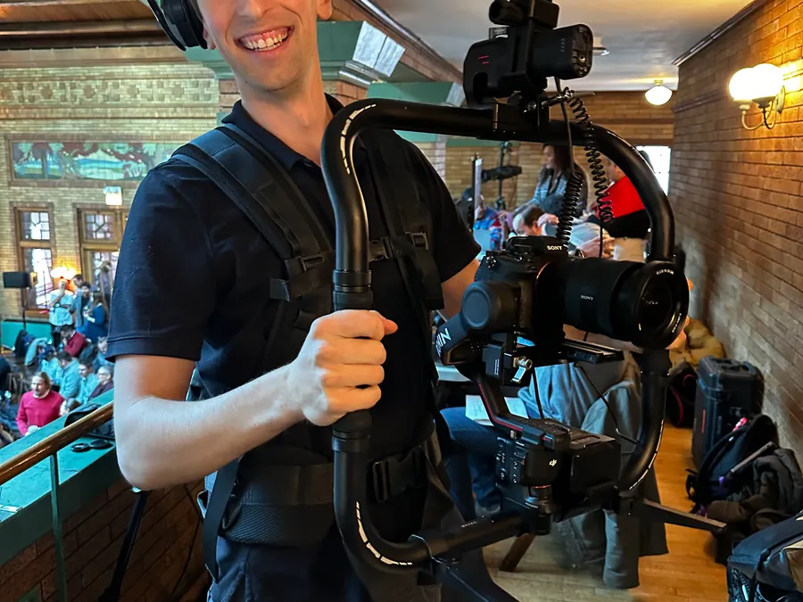 Director of photography setting up a corporate executive interview broadcast