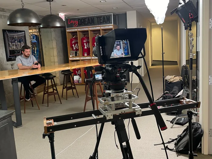 Executive delivering a quarterly business update on a live-stream production