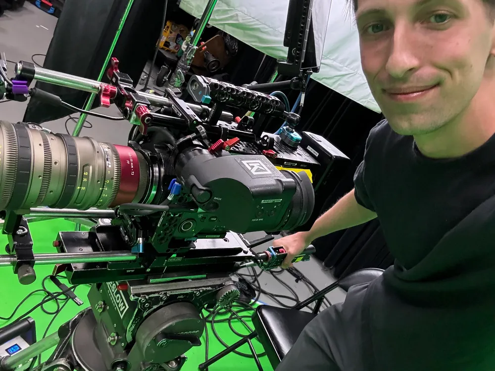 Camera operator capturing footage on set for social video content