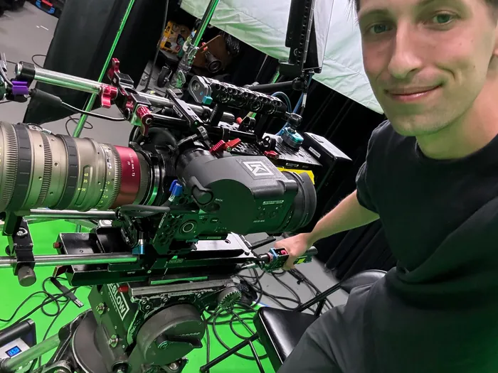 Camera operator capturing footage on set for social video content