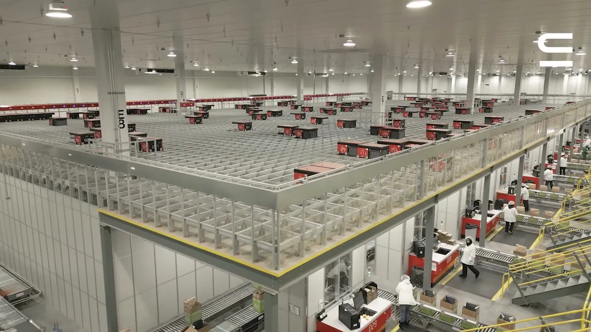 AutoStore robots operating across the top of the storage grid in the Swisslog-integrated HelloFresh fulfillment center
